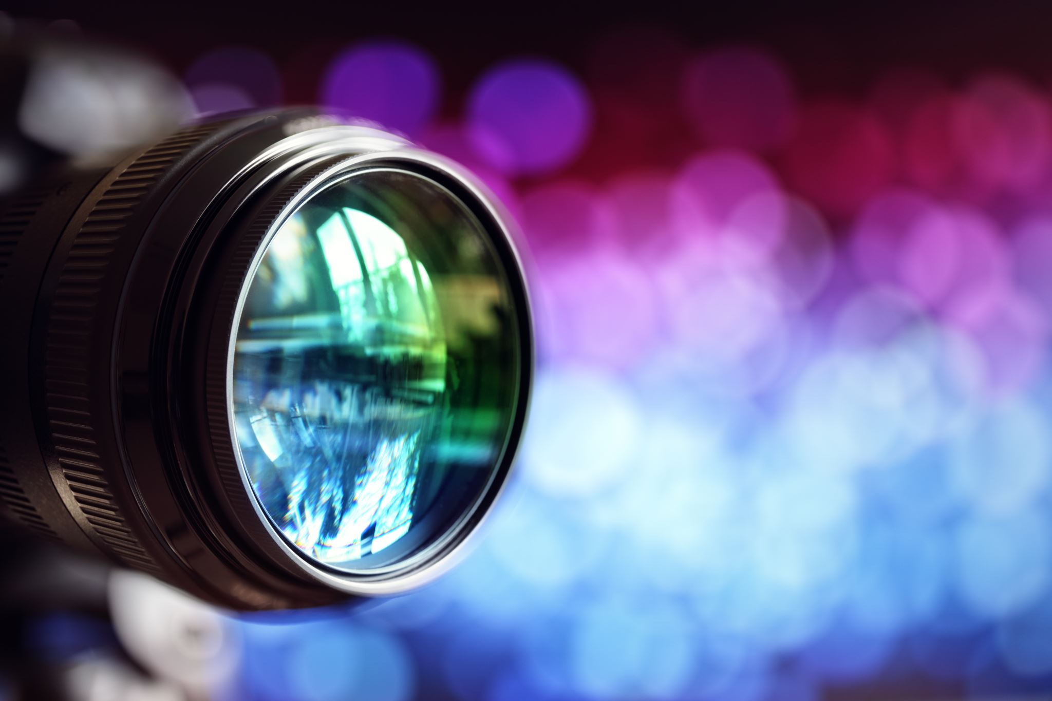 A broadcast camera lens with cyan and magenta bokeh