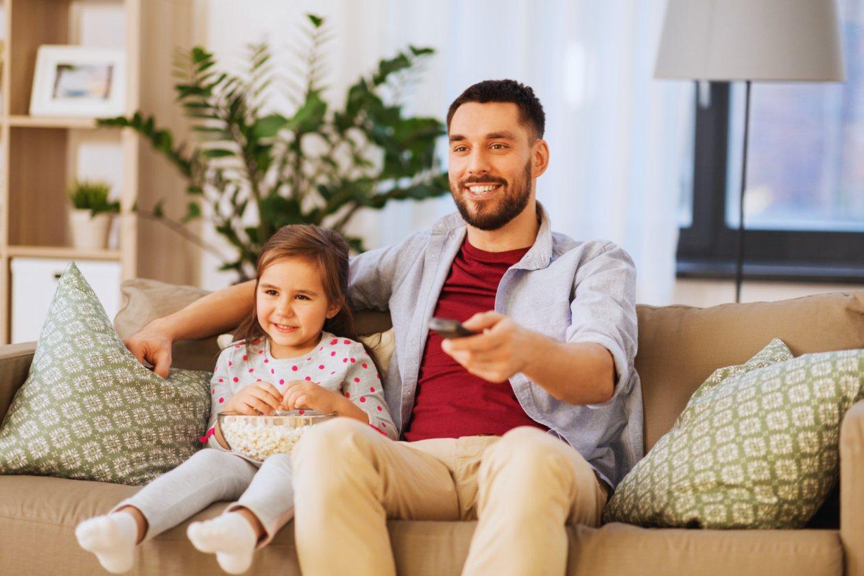 A family watching TV together at home